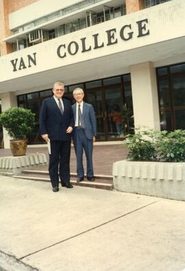 An unidentified guest and Dr.  Henry Hu