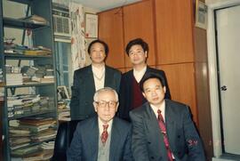 Three unidentified guests in Dr. Henry Hu's office
