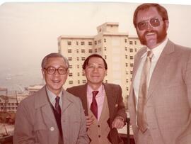 An unidentified guest, Dr. Henry Hu and Dr. Hu Yao-su
