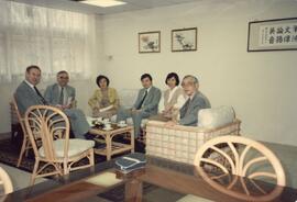 Dr. Henry Hu, Dr. Chung Chi-yung and unidentified guests at their office