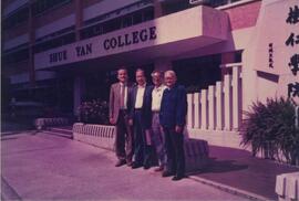 Mr. Hui Ci-sheng with three unidentified men at the entrance of Academic Building